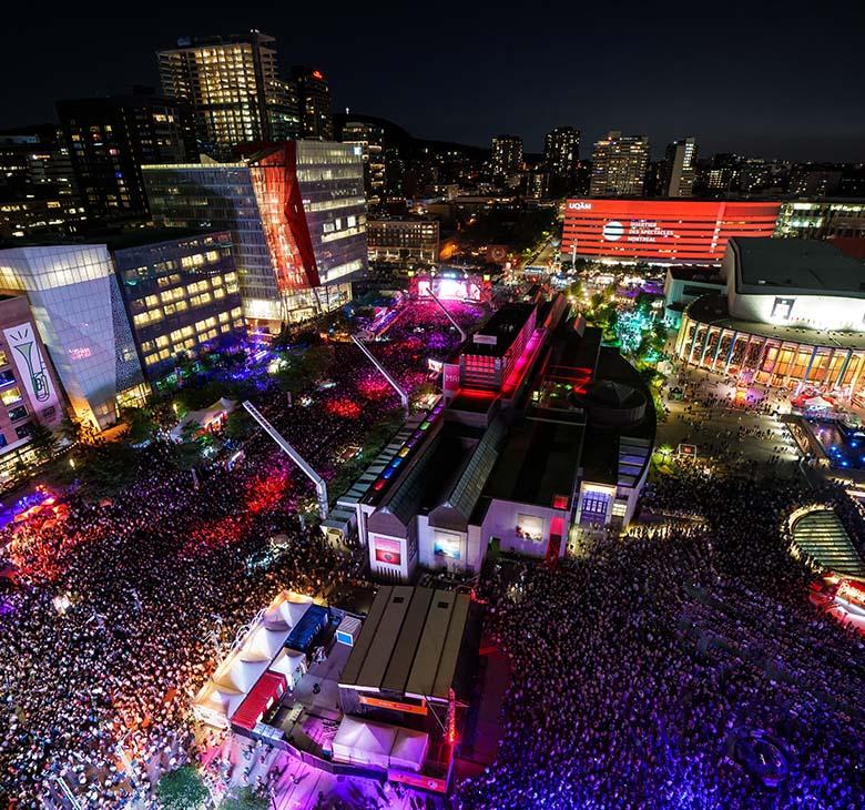 Festival International de Jazz de Montréal outdoor concert crowd at night
