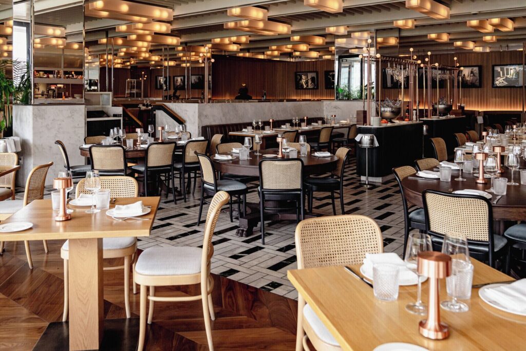 Stylish dining room at Marcus Restaurant in Four Seasons Hotel Montreal, Québec.