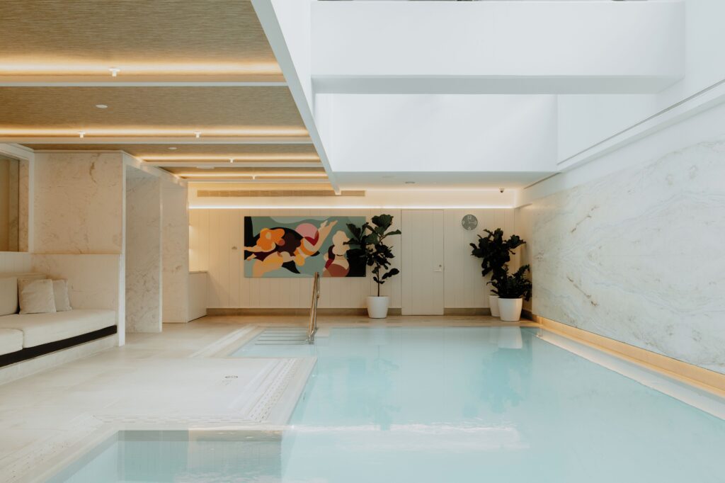 Indoor swimming pool at Four Seasons Hotel Montreal, offering a relaxing luxury hotel experience.